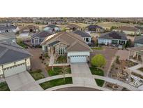 Charming single-Gathering home with a well-manicured lawn, complemented by a two-car garage and attractive stone accents at 8505 S Tibet Ct, Aurora, CO 80016