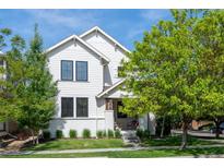 Charming two-story home with a well-manicured lawn and lovely curb appeal in a desirable neighborhood at 2899 Emporia Ct, Denver, CO 80238