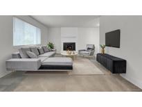 Bright living room featuring a fireplace, plush seating, and modern decor for comfortable living at 6250 S Windermere St, Littleton, CO 80120