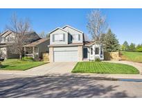 Charming two-story home with fresh green lawn and well-maintained landscaping at 2905 E Yarrow Cir, Superior, CO 80027
