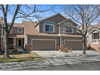 Charming two-story townhome with attached two-car garage, perfect for suburban living at 7700 W Grant Ranch Blvd # 7C, Littleton, CO 80123