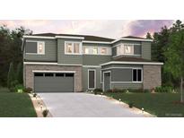 Inviting two-story home featuring stone accents and a spacious two-car garage at 2512 Lupton Ln, Lafayette, CO 80026