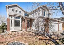 Charming two-story home with brick accents, bay window, and inviting front entrance at 10765 Willow Reed Ct, Parker, CO 80134