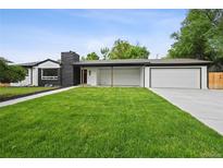 Charming single-story home featuring an attached garage, inviting front porch, and well-maintained lawn at 290 Beryl Way, Broomfield, CO 80020