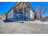 Condominium exterior with three levels and exterior staircases leading to upper units at 214 N Main St # 14, Breckenridge, CO 80424