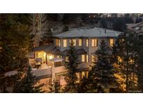 Stunning two-story home featuring a spacious deck and mountain views at 22419 Springflower Dr, Golden, CO 80401