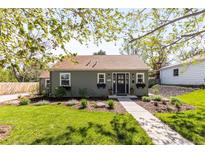 Charming single-story home featuring a well-manicured lawn and inviting curb appeal at 2520 S Race St, Denver, CO 80210