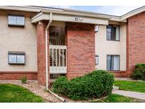 Charming exterior view with a brick staircase entrance and manicured landscaping at 595 Manhattan Dr # 203, Boulder, CO 80303
