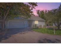 Attractive ranch-style home with a two-car garage and well-manicured lawn at 2834 S Heather Gardens Way # B, Aurora, CO 80014