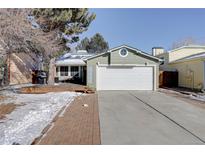 Charming single-Gathering home featuring a two-car garage, beautiful yard and mature trees at 5089 W 62Nd Ave, Arvada, CO 80003