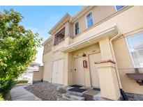 Inviting townhouse exterior features updated front entrance, stone accents and easy access with walkway and stairs at 847 E 98Th Ave # 1806, Thornton, CO 80229