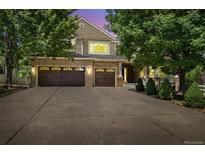 Beautiful brick home with a three-car garage and mature landscaping at 3901 Stonegrass Pt, Broomfield, CO 80023