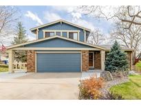 Charming two-story home featuring blue siding, brick accents, and a well-maintained front yard at 4620 W 108Th Pl, Westminster, CO 80031