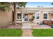 Charming home featuring a welcoming front porch, freshly cut grass, and meticulous landscaping at 3109 N Williams St, Denver, CO 80205