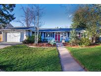 Charming single-story home with a well-manicured front yard and red door at 2261 W Briarwood Ave, Littleton, CO 80120