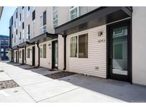 Modern townhouse exteriors featuring clean lines, black accents, and well-maintained landscaping at 3043 W 19Th Ave, Denver, CO 80204