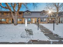 Attractive townhome with snow-covered front yard at 12906 W 24Th Pl, Golden, CO 80401