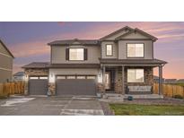 Beautiful two-story home with a three car garage and covered porch at 8395 E 132Nd Pl, Thornton, CO 80602