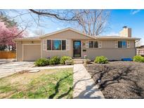 Charming single-story home with manicured lawn, mature trees, and inviting front porch at 2756 E Euclid Ave, Centennial, CO 80121