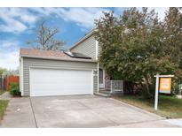 Charming home featuring a spacious two-car garage and well-maintained lawn at 3961 S Uravan St, Aurora, CO 80013