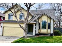 Charming two-story home with a well-maintained lawn and attached two-car garage at 9686 W 106Th Ave, Broomfield, CO 80021