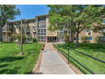 Building exterior showcasing landscaping and walkway at 13500 E Cornell Ave # 309, Aurora, CO 80014