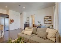 Cozy living room featuring hardwood floors, modern decor, and an open floor plan at 9283 Twenty Mile Rd # 403, Parker, CO 80134