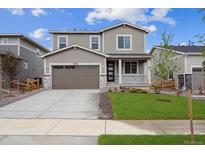 Charming two-story home features a well-manicured lawn and welcoming front porch, perfect for enjoying the outdoors at 24737 E 40Th Ave, Aurora, CO 80019