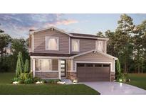 Charming two-story home featuring neutral siding, a covered porch and a two car garage at 24737 E 40Th Ave, Aurora, CO 80019