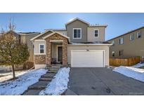 Two-story house with stone accents and a two-car garage at 3980 Trailstone Cir, Castle Rock, CO 80108