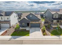 Charming single-Gathering home boasting manicured lawn, stone accents, and a two-car attached garage at 8132 Mt Harvard Rd, Littleton, CO 80125