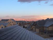 Scenic view of a neighborhood with the city skyline and mountains in the background at sunset or sunrise at 237 Dayton St, Denver, CO 80230