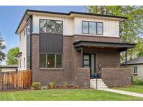 Modern two-story home with brick facade, light upper siding, and manicured lawn at 1373 S Garfield St, Denver, CO 80210