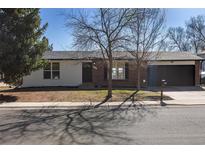 A single-Gathering home showing the front exterior with brick and white siding at 1266 S Telluride St, Aurora, CO 80017