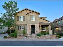 Charming two-story home featuring a stone entryway and well-manicured landscaping at 10618 Clearview Ln, Highlands Ranch, CO 80126