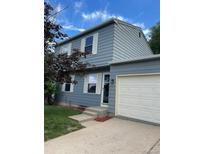 Charming two-story home with light blue siding, white trim, and a well-maintained lawn at 10050 Holland Ct, Broomfield, CO 80021