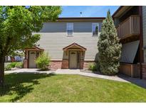 Inviting two-story townhome with a well-maintained lawn and charming brick accents at 11085 Huron St # 1108, Northglenn, CO 80234