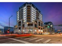 Beautiful multi-story building featuring exquisite architecture and nighttime city views at 975 N Lincoln St # 4F, Denver, CO 80203