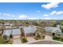 Inviting brick home with a well-maintained front yard and attached two-car garage, set in a desirable neighborhood at 4927 Greenwich Way, Highlands Ranch, CO 80130
