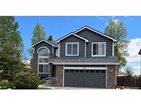 Charming two-story home featuring a brick accent, fresh paint and a two-car garage at 12742 Clermont St, Thornton, CO 80241