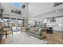 Open floor plan showcasing living room, kitchen, and dining area at 624 Simmental Loop, Castle Rock, CO 80104