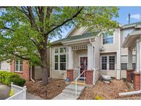Inviting exterior showcasing a charming two-story home with manicured landscaping and a quaint front porch at 604 S Yarrow St, Lakewood, CO 80226