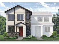 Two-story modern home with stone accents and landscaped yard at 1438 Coral Pl, Longmont, CO 80504