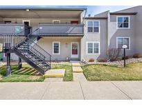 Charming condo with private entrance, landscaped yard, and convenient stair access to the upper levels at 2301 E Fremont Ave # W02, Centennial, CO 80122