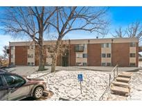 Brick apartment building featuring balcony, parking and accessible access at 3623 S Sheridan Blvd # 8, Denver, CO 80235