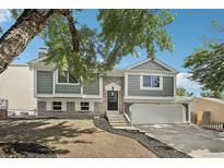 Charming two-story home with a well-manicured front yard and attached garage, perfect for suburban living at 19954 E Dartmouth Ave, Aurora, CO 80013