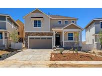 Charming two-story home featuring stone accents and a covered front porch at 459 S Salida St, Aurora, CO 80017