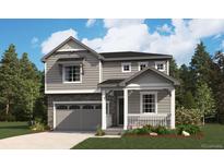 Charming two-story home featuring a stone-accented garage and inviting front porch in a serene, landscaped setting at 459 S Salida St, Aurora, CO 80017