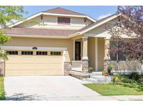 Charming single Gathering home with a manicured lawn and welcoming front porch at 836 Sundance Ln, Erie, CO 80516