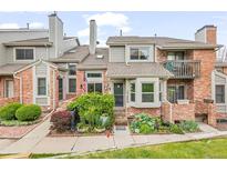 Charming brick townhome with well-maintained landscaping and inviting entrance at 15149 E Princeton Pl # B, Aurora, CO 80014